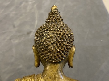 A Chinese gilt bronze figure of Buddha, 17th C.